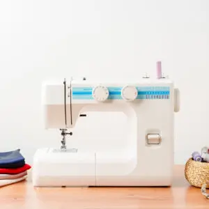 Sewing machine with fabric and tools