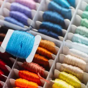 Colorful embroidery threads organized in a box