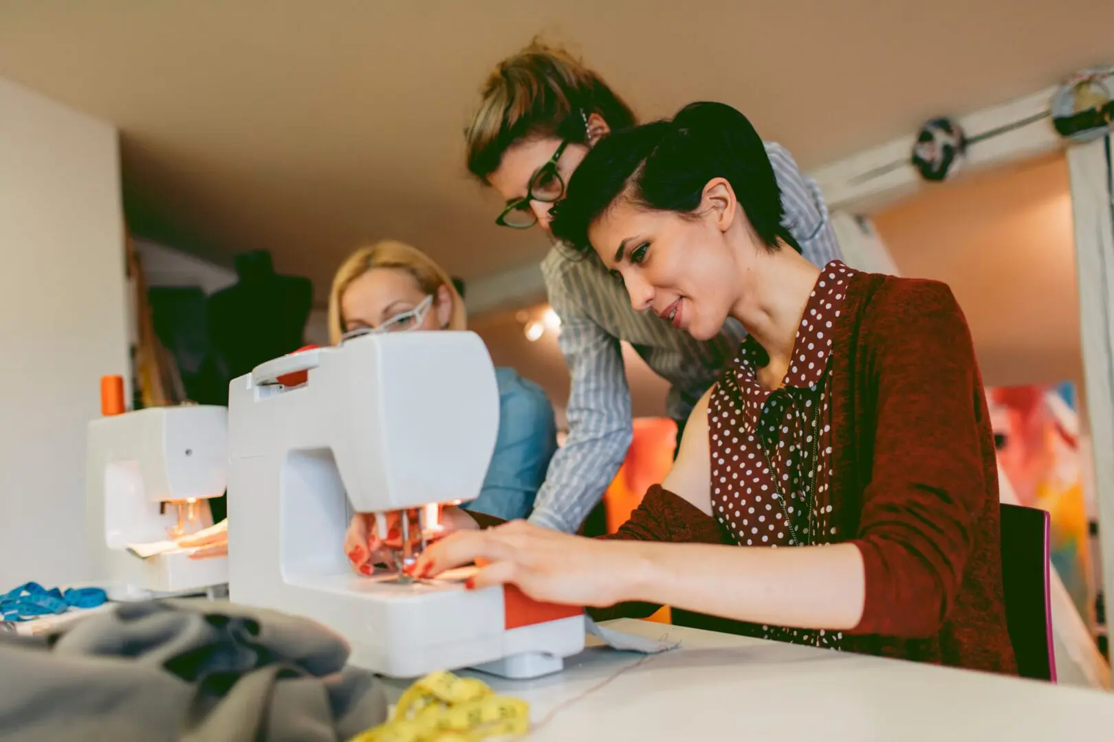 Women focused on sewing project